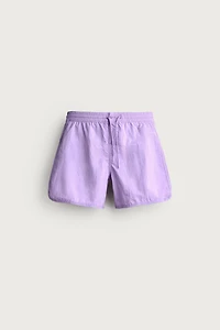 MID-LENGTH SWIMSUIT WITH VENTS