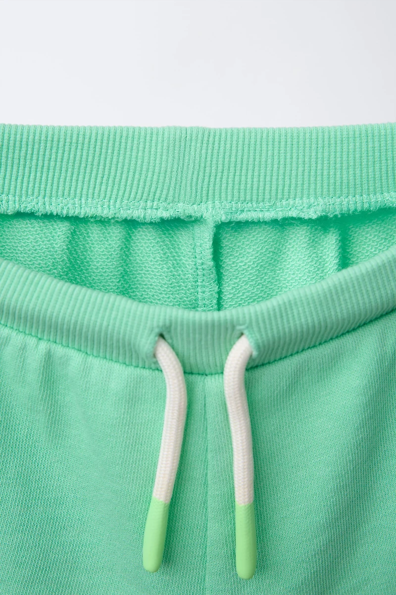 EMBROIDERED PLUSH SHORTS