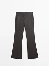 Waxed flare fit trousers