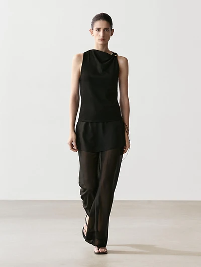 Draped neckline top with brooch detail