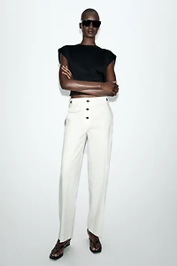 PANTALON À BOUTONS MÉTALLIQUES