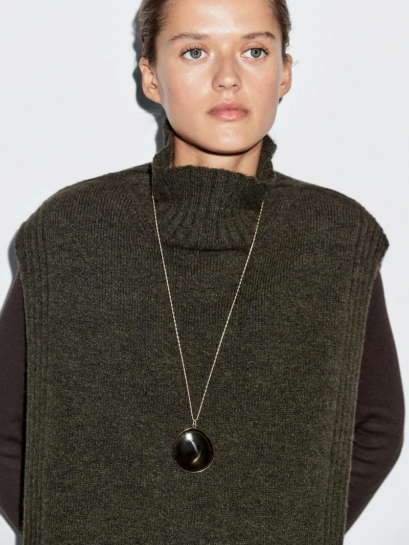 Sleeveless high neck sweater