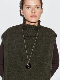 Sleeveless high neck sweater