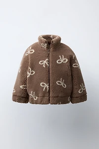 FAUX SHEARLING JACKET WITH BOW PRINT