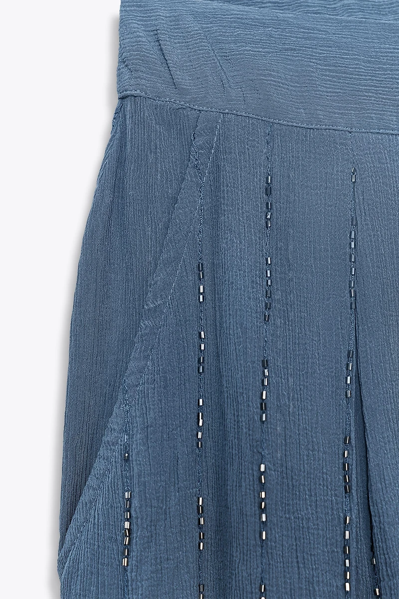 BEADED PANTS WITH TIED HEMS