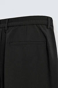 PLEATED WIDE FIT PANTS