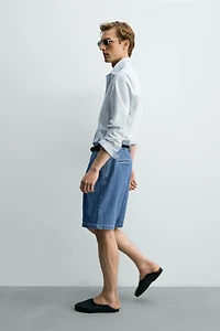 RELAXED FIT PLEATED DENIM SHORTS