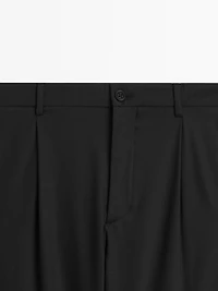 Relaxed fit trousers with darts