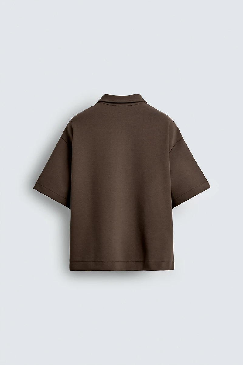 POLO INTERLOCK À ZIP