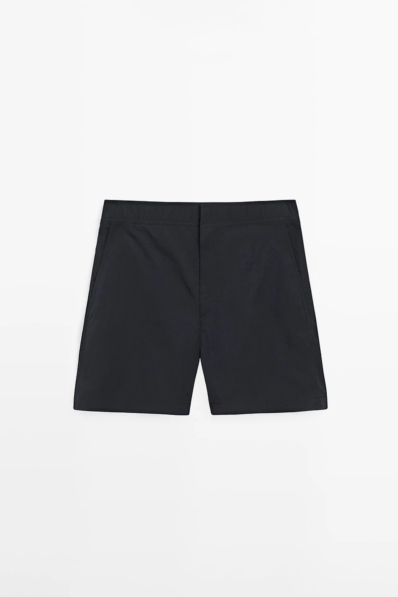 Plain swimming trunks with waist detail