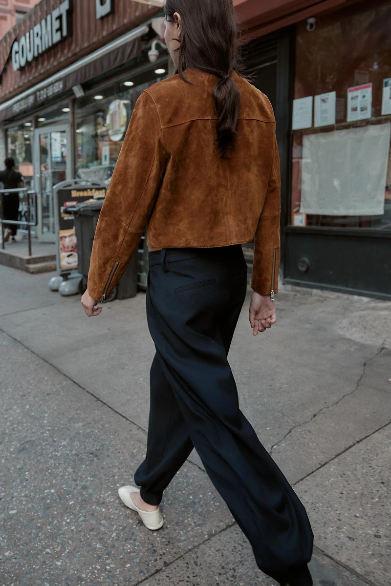 PLEATED PANTS WITH BUTTONED HEM