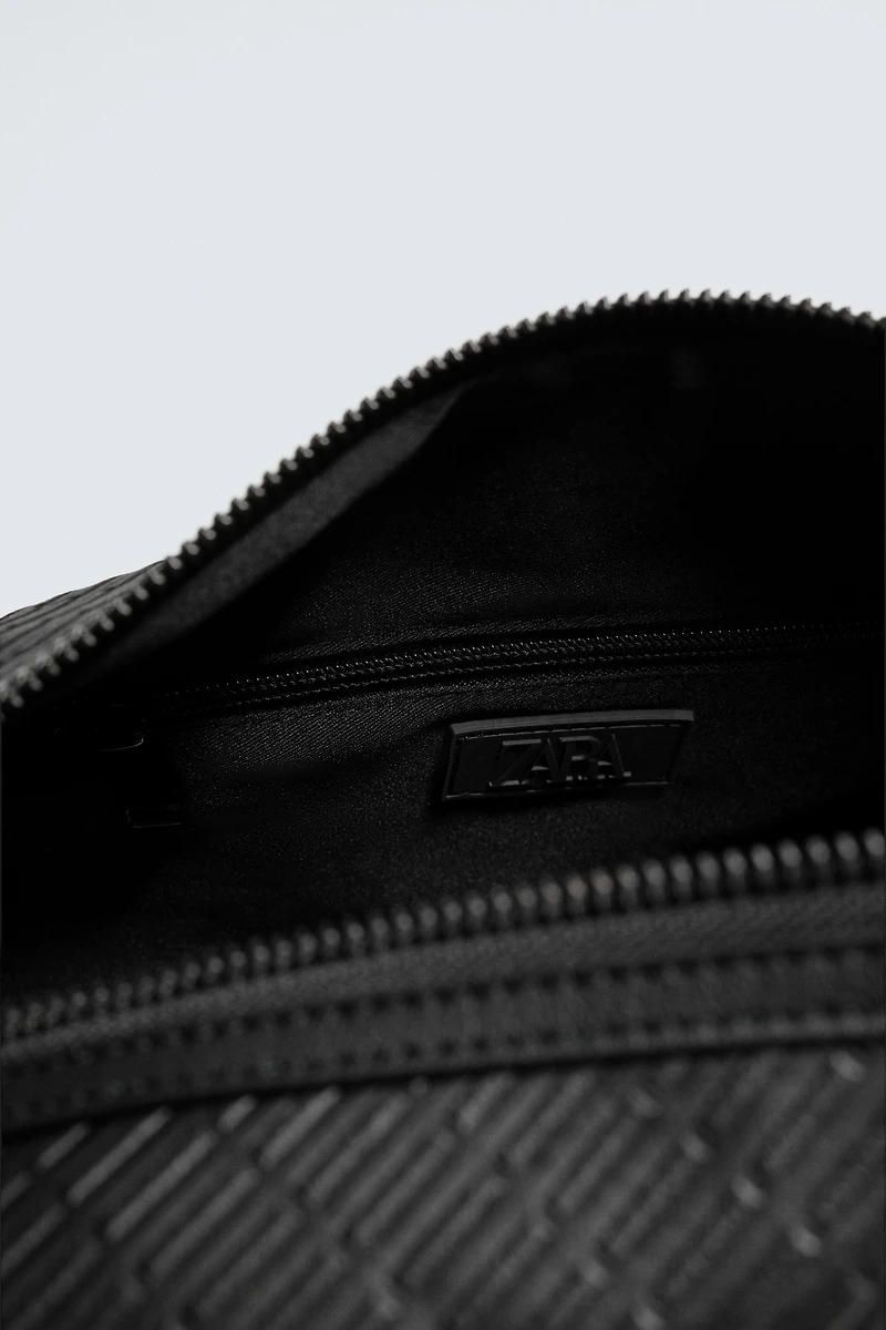 TEXTURED RUBBERIZED CROSSBODY BAG