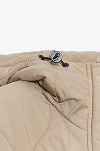 VESTE MATELASSÉE À CAPUCHE DÉPERLANTE