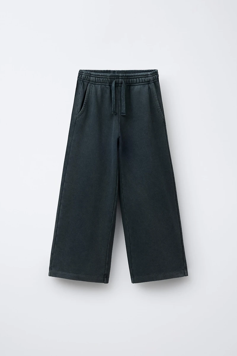 PANTALON WIDE LEG EFFET DÉLAVÉ ÉTOILES CLOUS