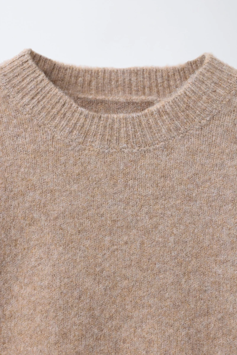 PULL EN MAILLE À VOLANTS