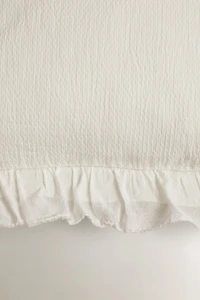HOUSSE DE COUSSIN TEXTURE VOLANT