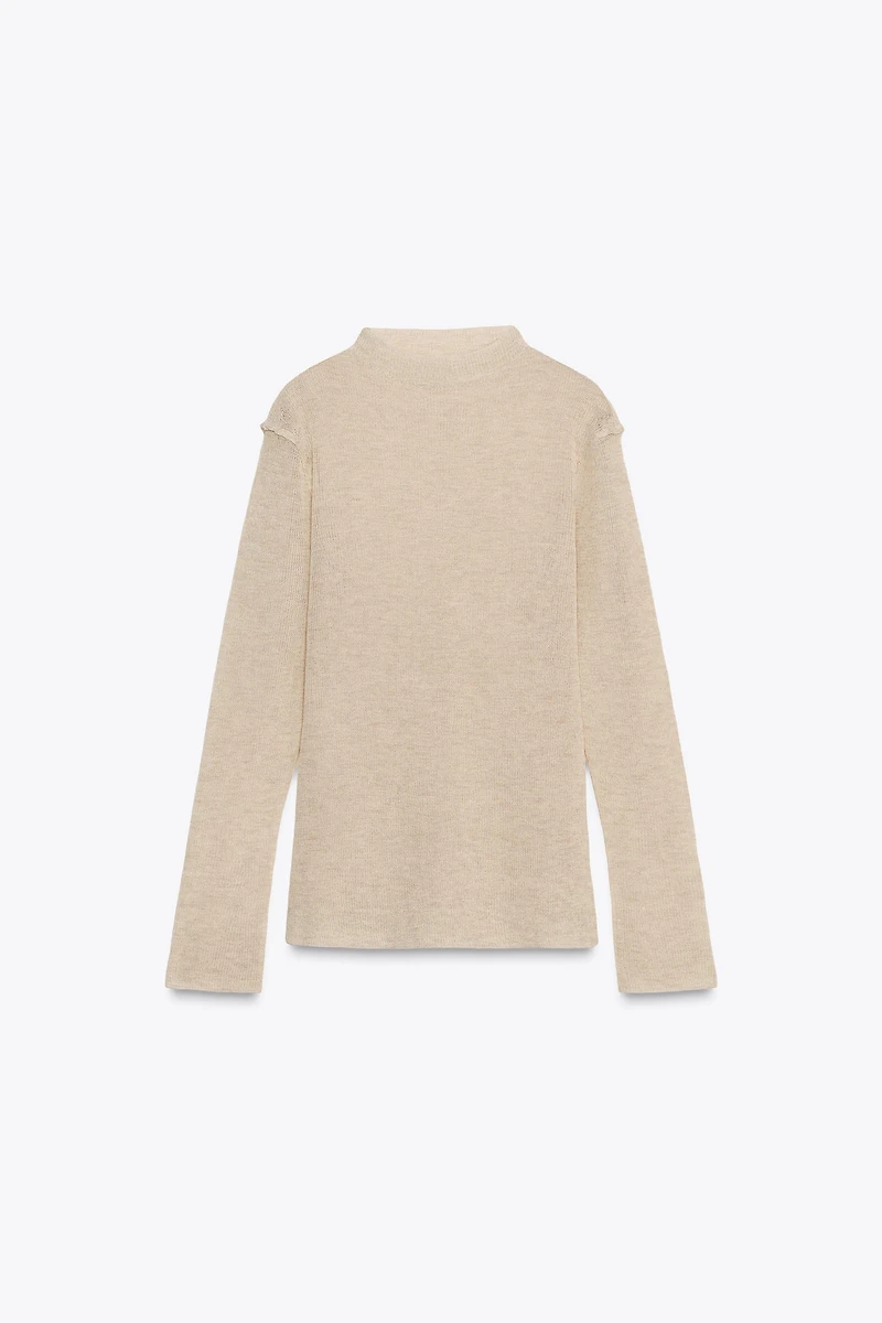 PULL EN MAILLE À COL CHEMINÉE