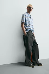 STUDDED FAUX LEATHER RELAXED FIT PANTS