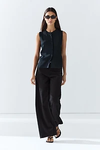 Fine-knit vest with covered buttons
