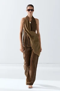 Total look flowing striped pants with button hem