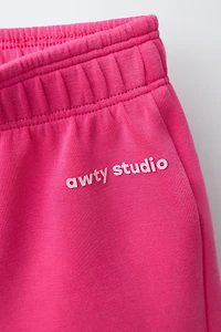 ATHLETIC EMBOSSED TEXT SHORTS