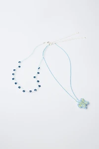 PACK OF TWO BUTTERFLY AND FLOWER BEADED NECKLACES