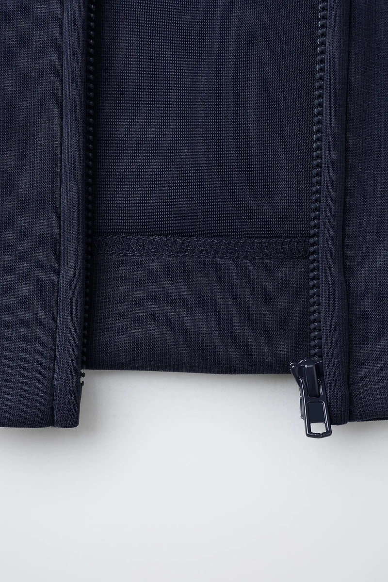 RAISED TEXT HOODED SWEATSHIRT
