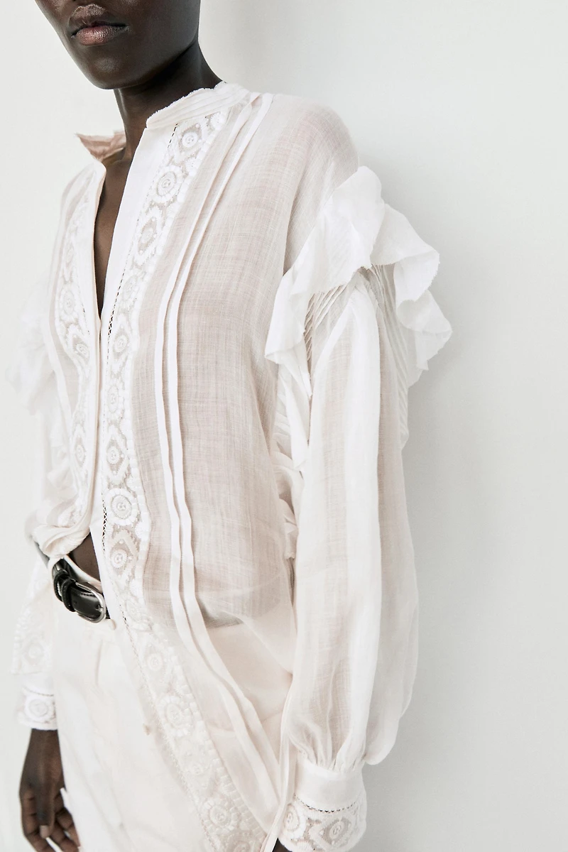 Stand collar blouse with embroidery and ruffles
