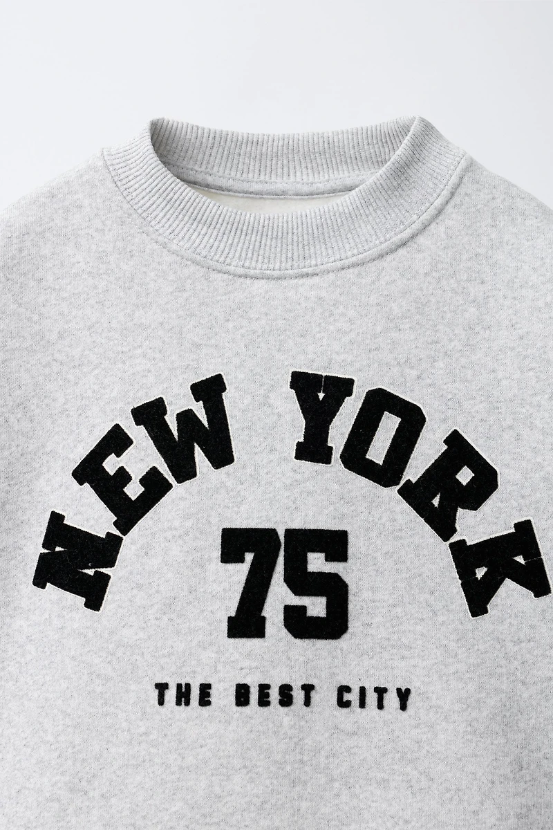 FLOCKED TEXT PRINT SWEATSHIRT