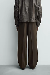 PANTALON COUPE LARGE À PLIS