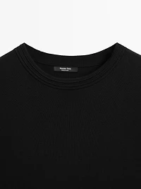 Short knit dress with side button details
