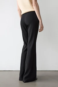 Flared trousers with pocket
