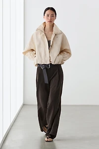 Wide-leg flowing trousers with darts
