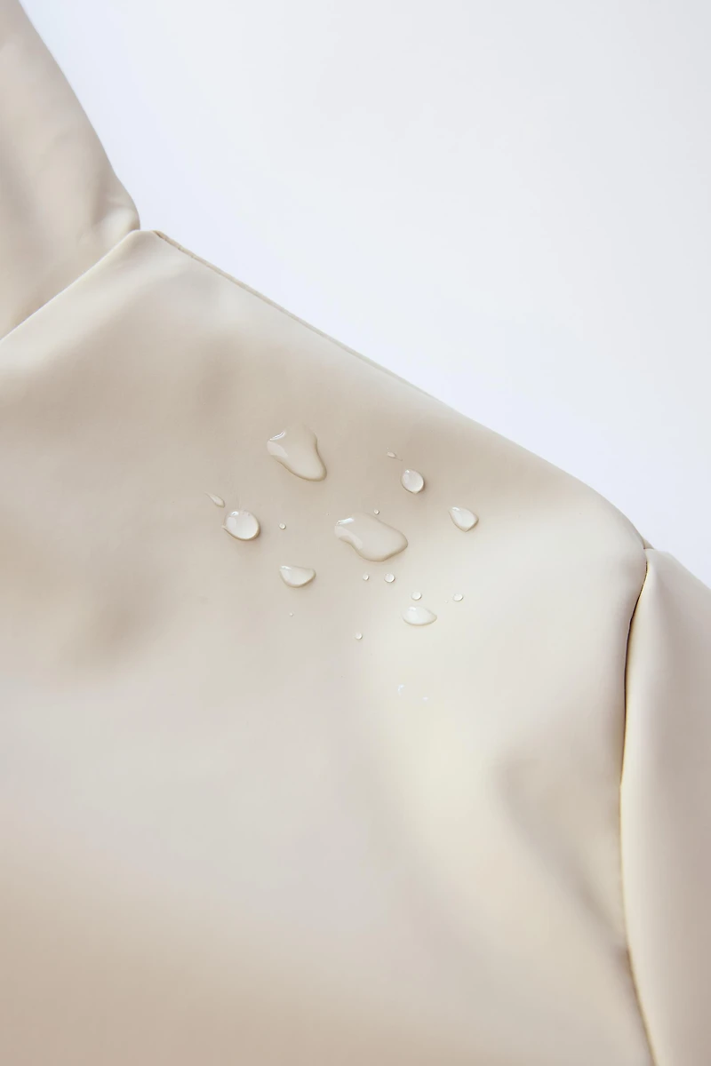 RUBBERIZED WATER RESISTANT FUR EFFECT RAINCOAT