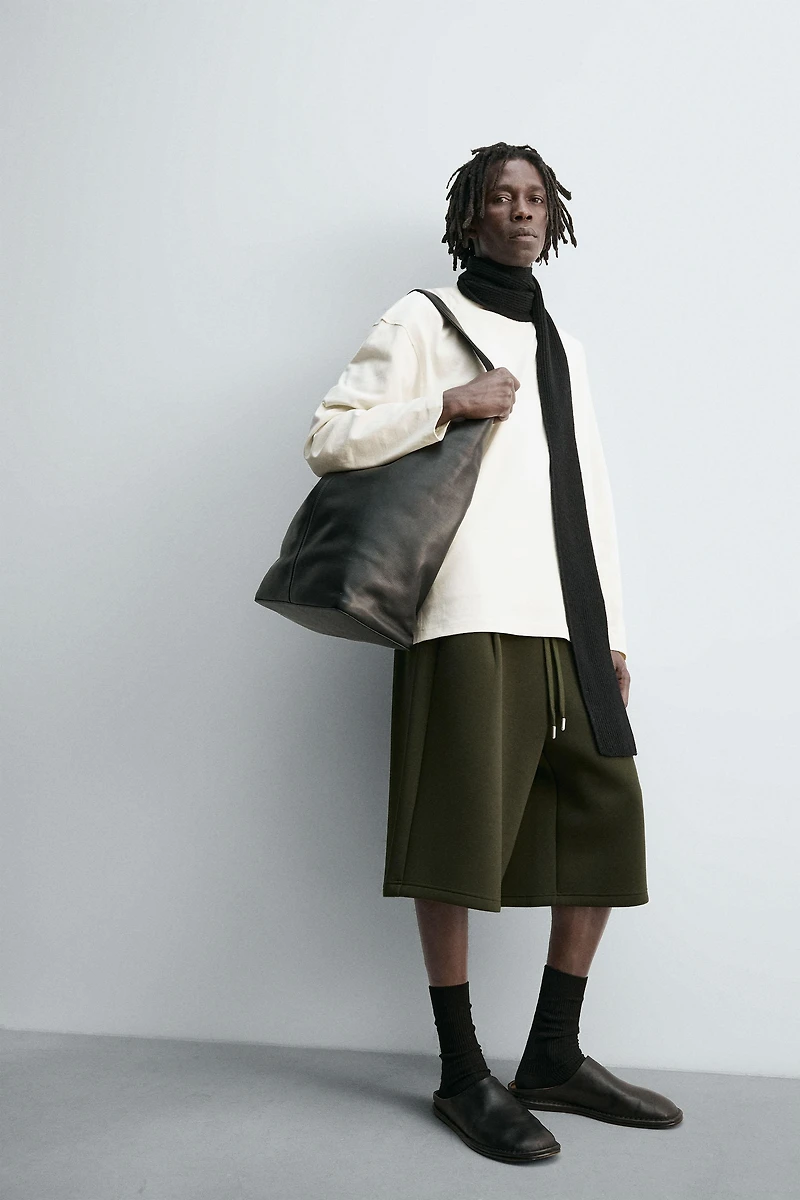 NEOPRENE EFFECT PLEATED LONG BERMUDA SHORTS