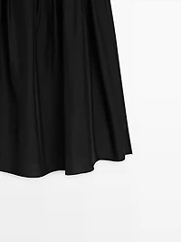 Jupe midi fluide avec détails de pinces