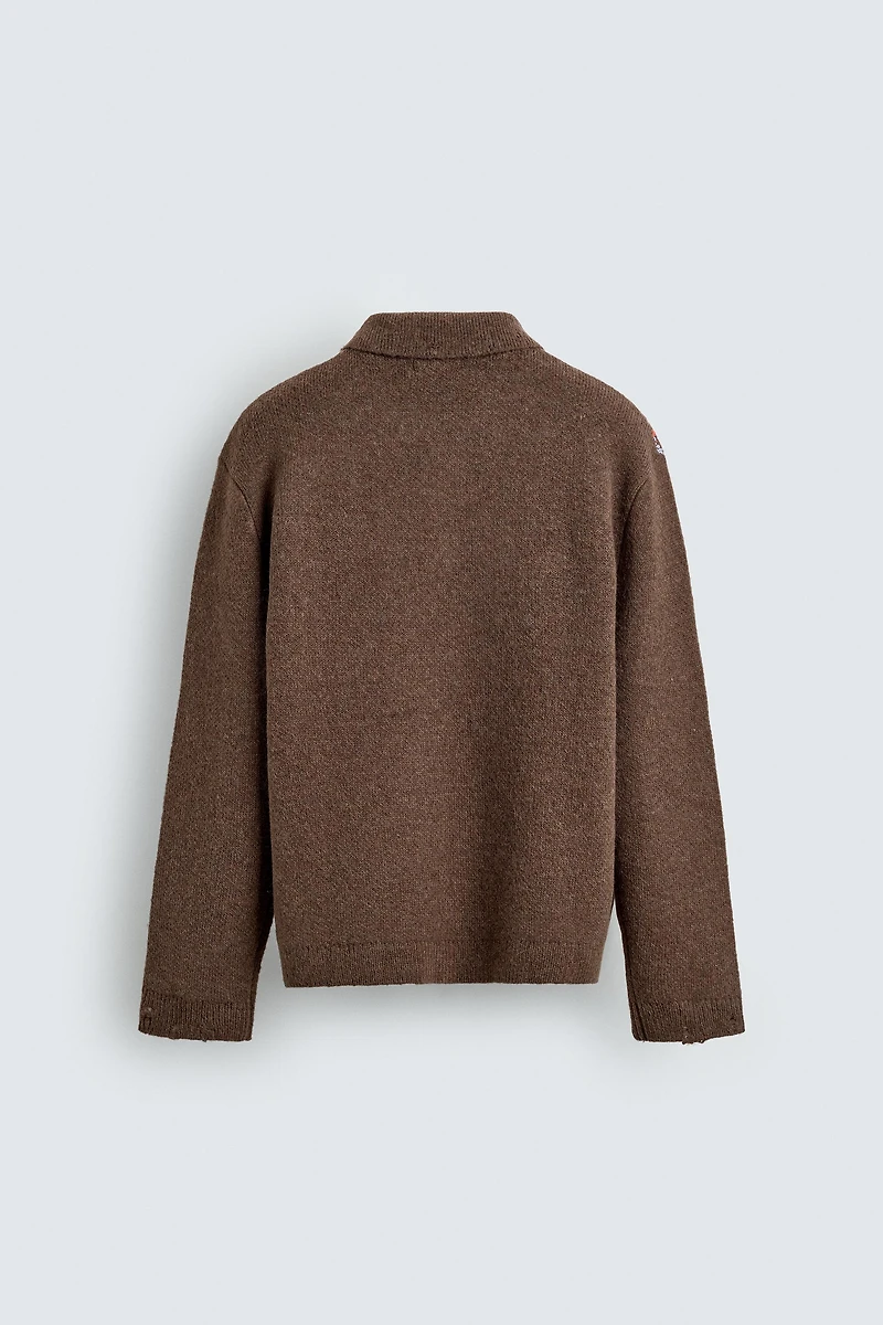 KNIT LOZENGE PATTERN POLO WITH DISTRESSED EFFECT