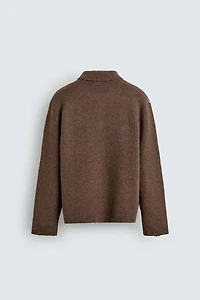 KNIT LOZENGE PATTERN POLO WITH DISTRESSED EFFECT