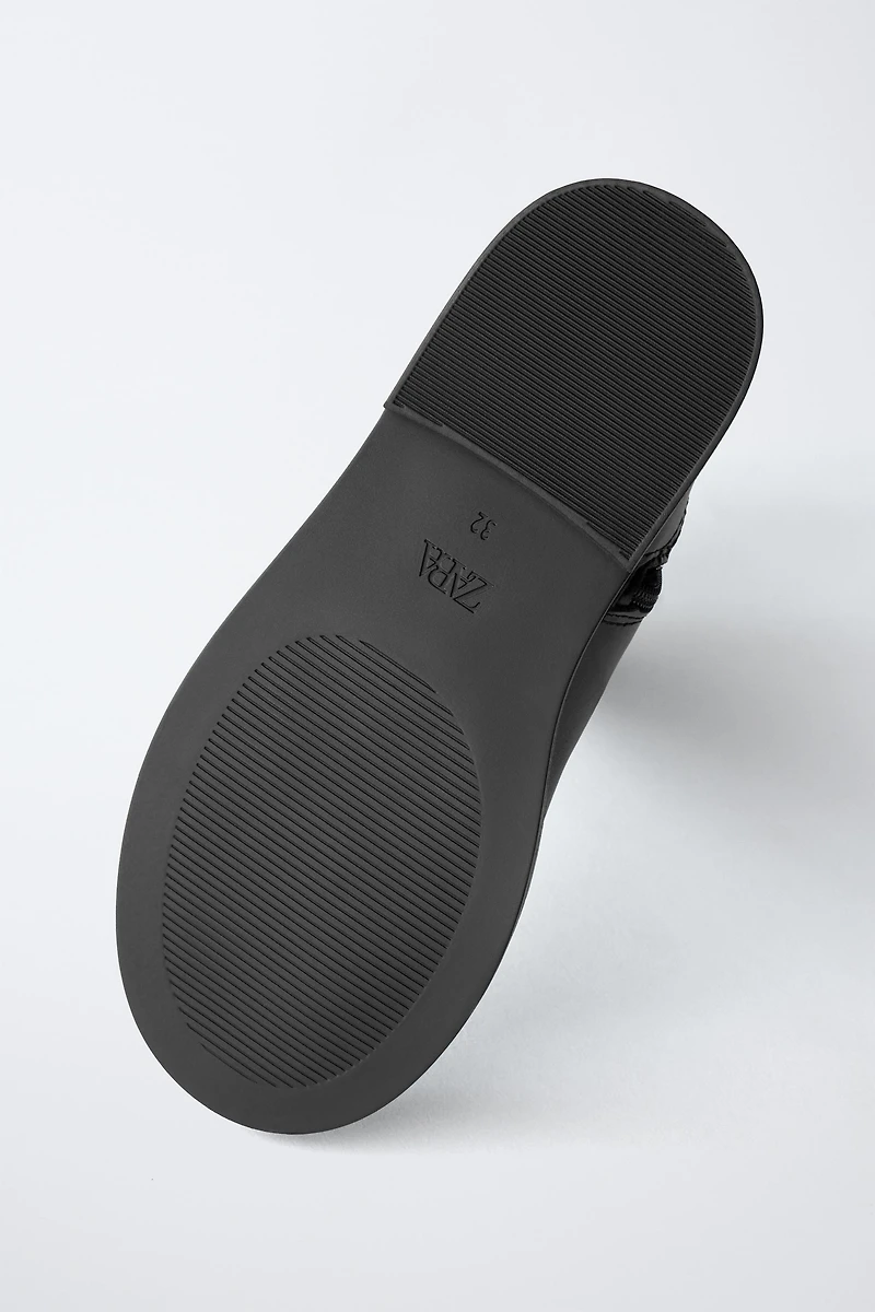 BOTTES HAUTES À BOUCLE