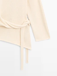 Asymmetric linen blend sweater with tie detail