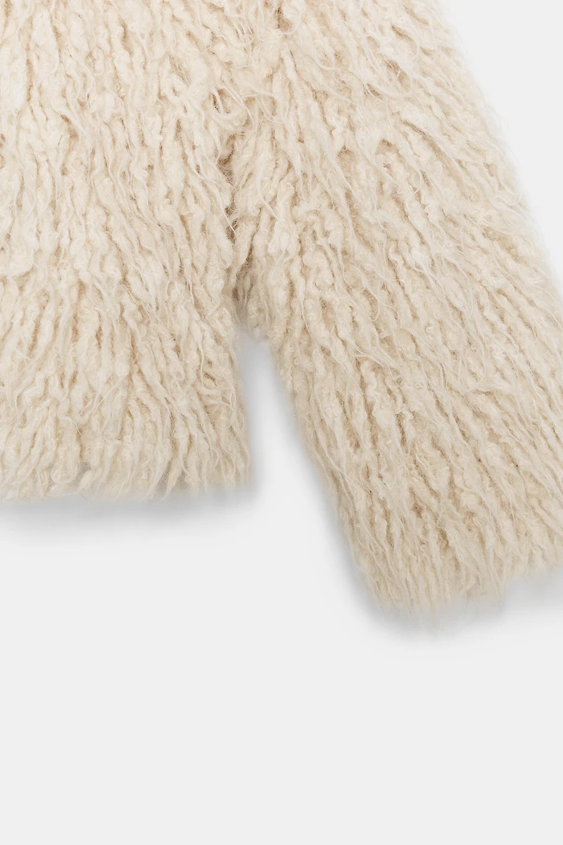 GILET EN MAILLE À FRANGES EFFET BROSSÉ