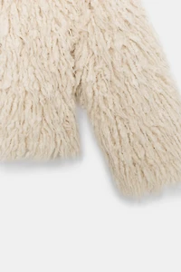 GILET EN MAILLE À FRANGES EFFET BROSSÉ