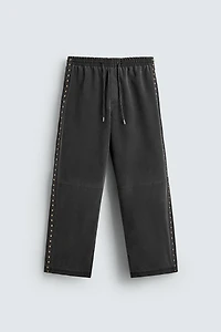 STUDDED FAUX LEATHER RELAXED FIT PANTS
