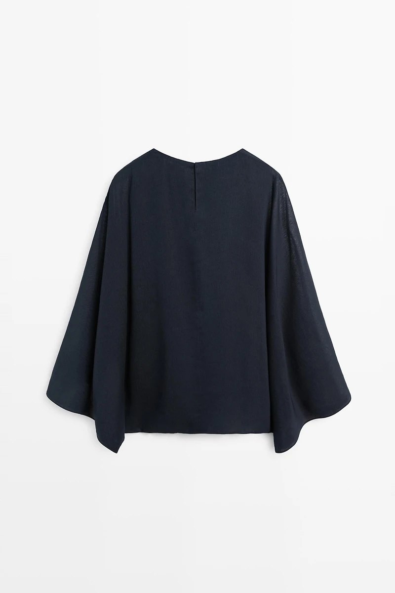 Asymmetric flowing cape
