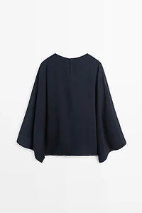 Asymmetric flowing cape