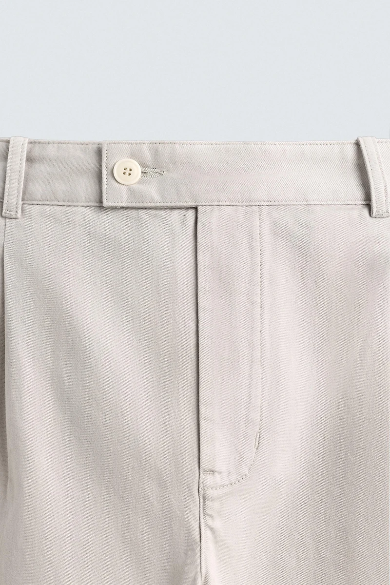RELAXED FIT PLEATED PANTS
