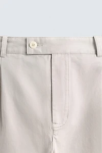RELAXED FIT PLEATED PANTS