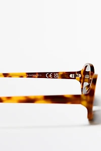 Oval tortoiseshell-effect sunglasses