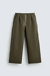 WIDE FIT NEOPRENE EFFECT PANTS WITH STUDS