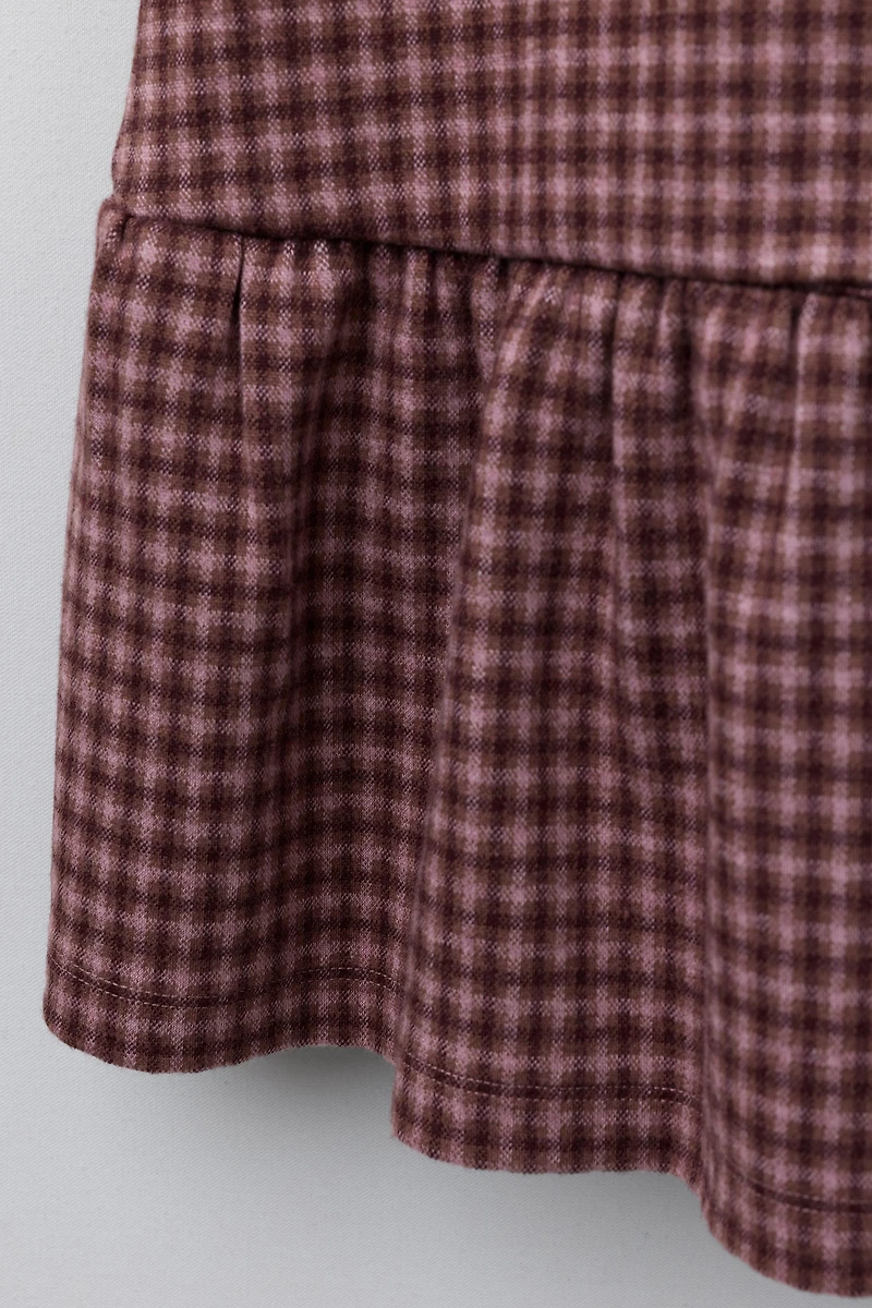 ROBE-SALOPETTE À CARREAUX ET NŒUDS